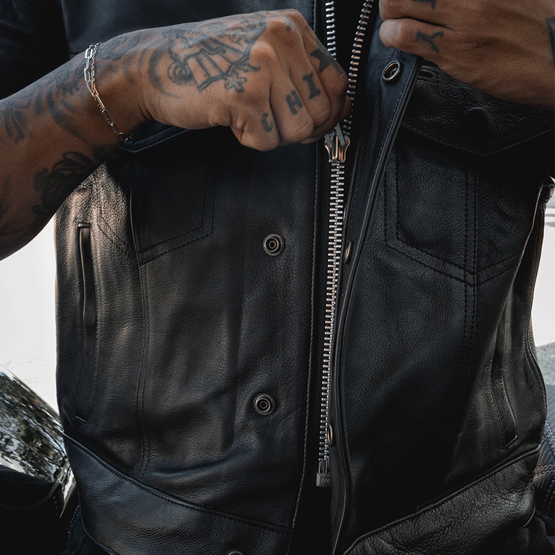  Made from cowhide leather, it includes four exterior pockets, two inside concealed carry pockets, a zip snap main closure, antique brass hardware, and a one-panel back, offering both style and functionality for various settings.