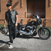  Made from cowhide leather, it includes four exterior pockets, two inside concealed carry pockets, a zip snap main closure, antique brass hardware, and a one-panel back, offering both style and functionality for various settings.