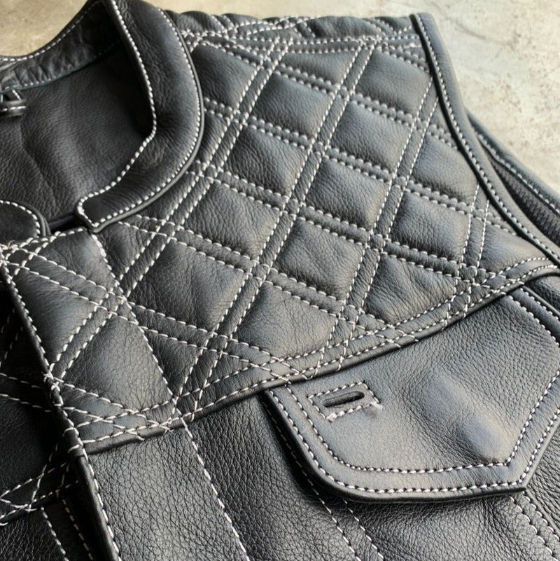 The Men's Diamond Stitch Club Vest by Unik Premium combines sophisticated design with practical features. Made from cowhide leather with a diamond stitch pattern.