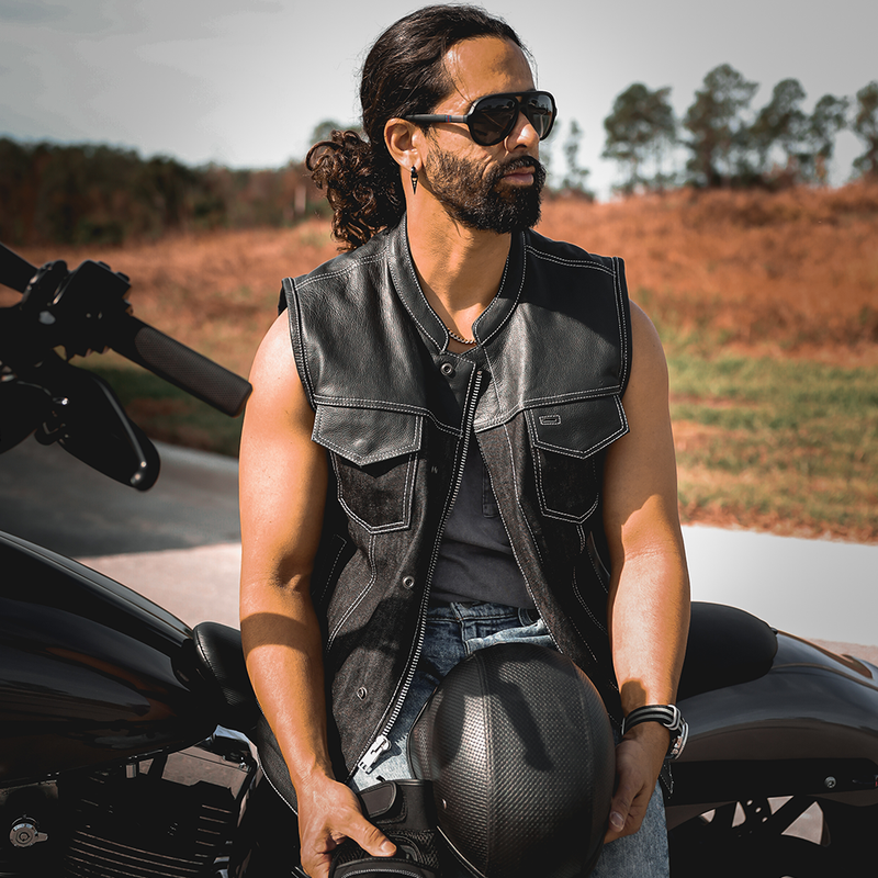  Featuring four exterior pockets, two inside concealed carry pockets, a zip snap main closure, antique brass hardware, and a one-panel back, this vest provides both practicality and unique aesthetic appeal.