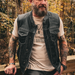  Featuring four exterior pockets, two inside concealed carry pockets, a zip snap main closure, antique brass hardware, and a one-panel back, this vest provides both practicality and unique aesthetic appeal.
