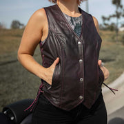 Style # 6897.17 epitomizes timeless elegance and functionality with a ladies' premium traditional vest crafted from luxurious lambskin leather