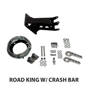 A collection of RWD V-Twin motorcycle parts for a Road King with a crash bar, including a black mounting bracket, a chrome headlight bezel, various bolts, washers, and two silver linkage arms.