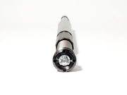 A close-up, eye-level shot of an RWD V-Twin RS-1F front fork cartridge, showcasing its black anodized cap with the RWD logo, silver spring, and gray body against a clean white background.